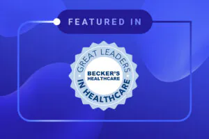 A blue badge with the words Great Leaders in Healthcare and Becker’s Healthcare in the center, above which is the text “Featured In,” set against a blue abstract background.
