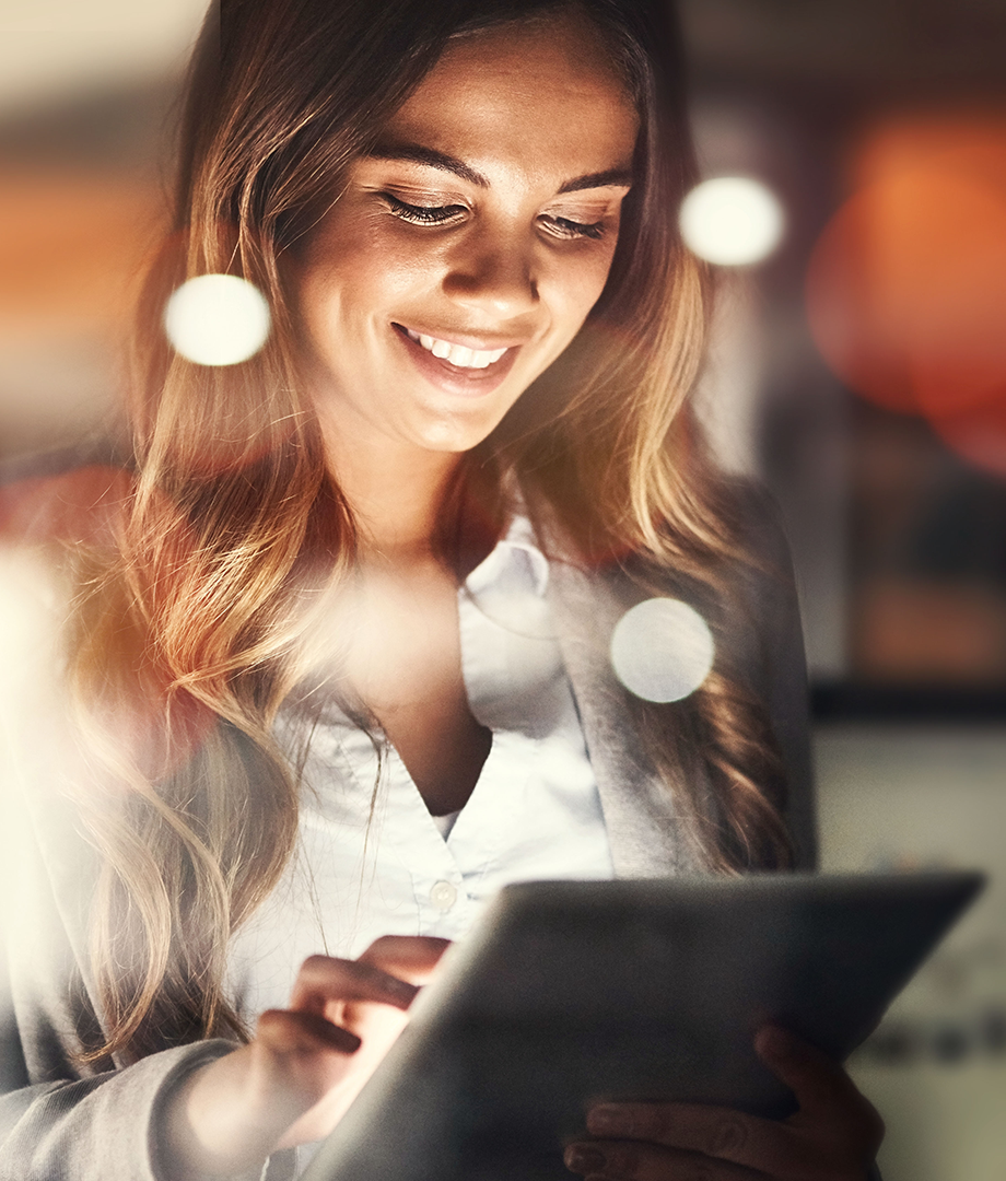 Female doctor entering data into system on tablet device.