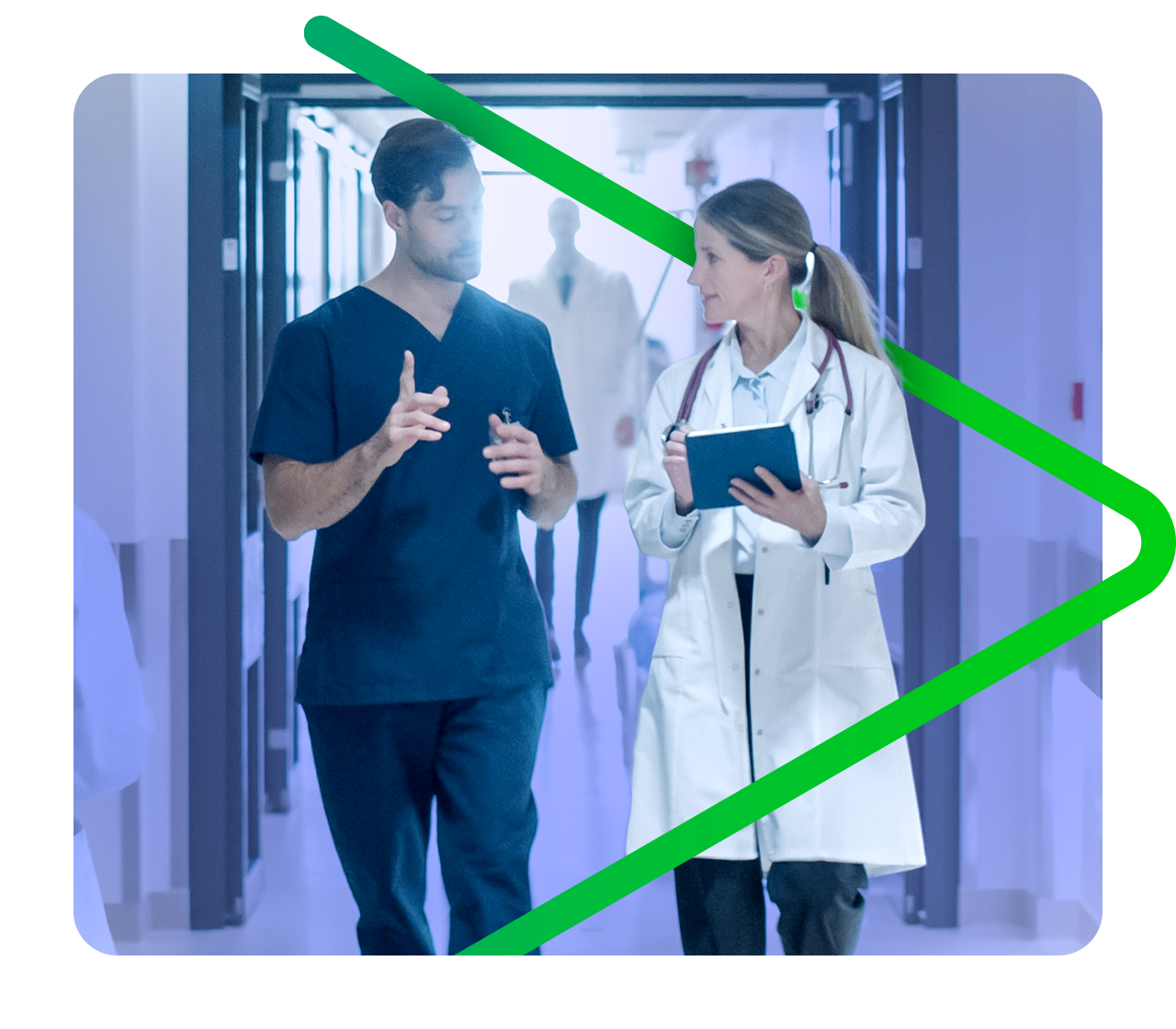 Nurse and doctor discussing treatment while walking down a hallway.