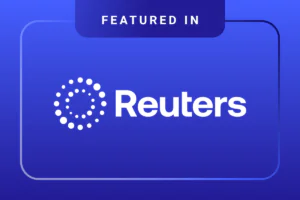 A blue graphic with the text Featured in Reuters and the Reuters logo, which consists of circular white dots forming a ring next to the Reuters name.
